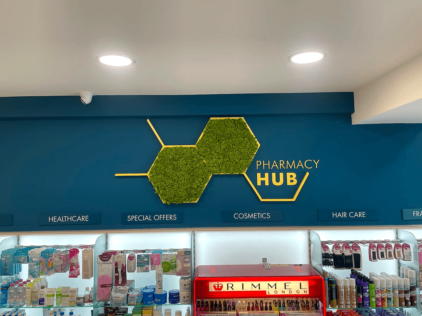 Wide night-time storefront at Pharmacy Hub, Tallaght